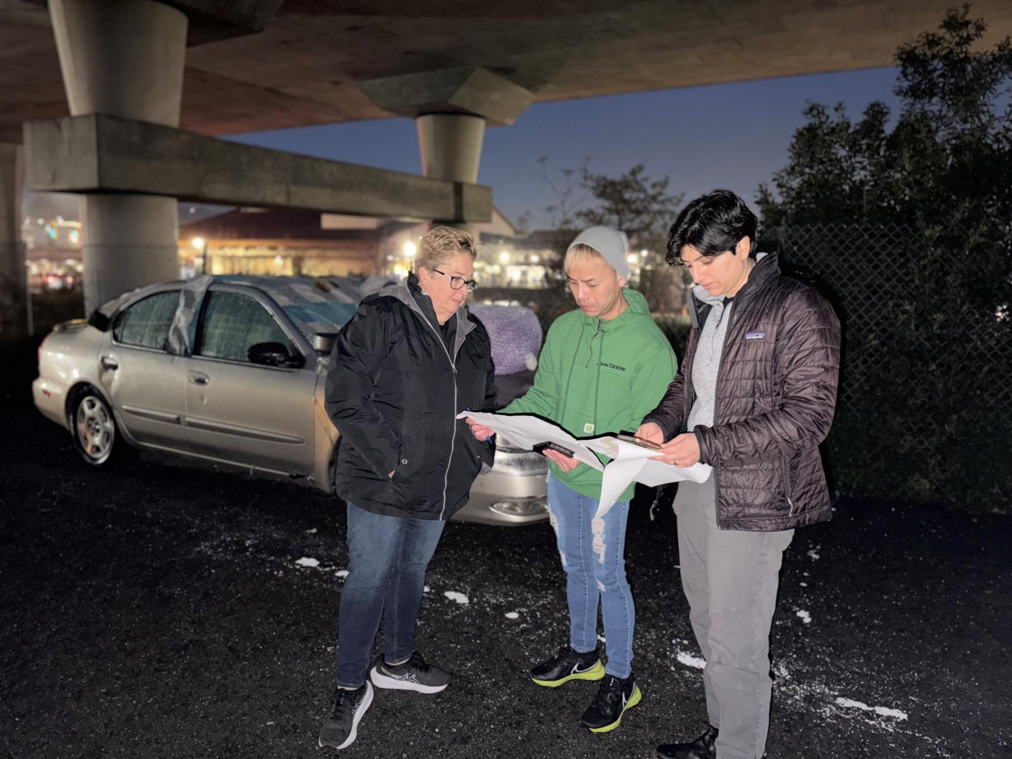 Volunteers review a map together on the morning of the count.