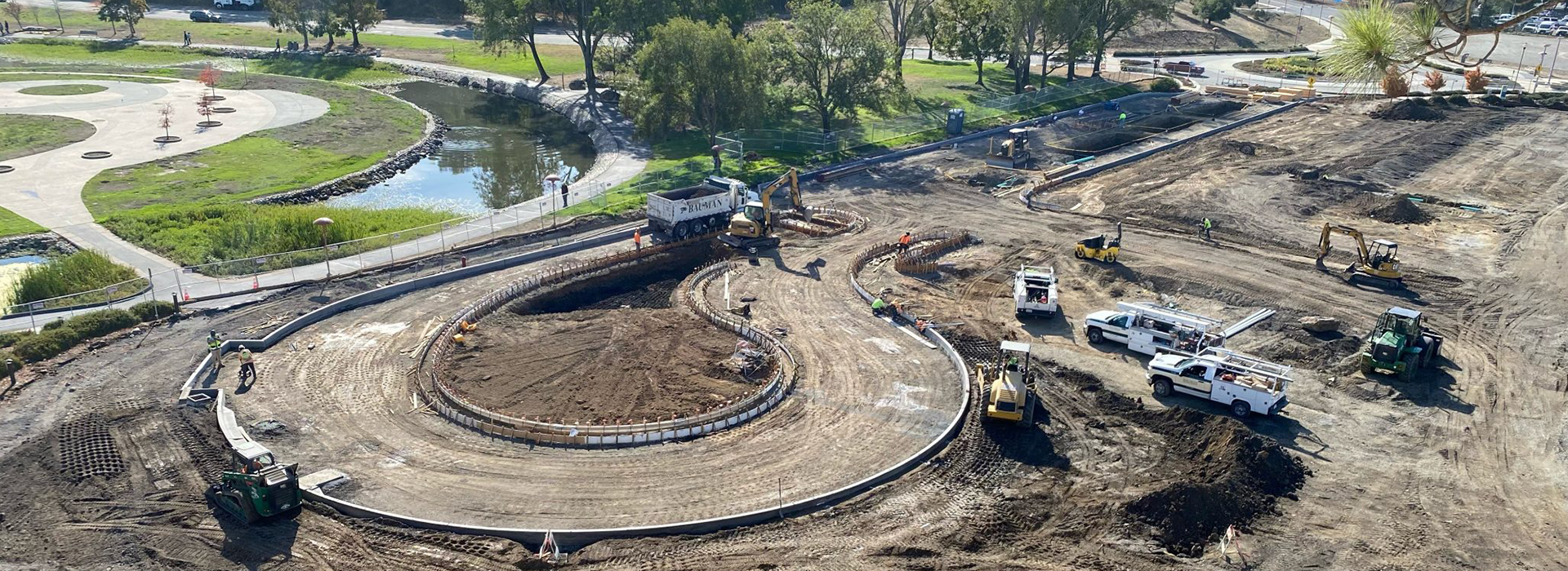 a December 2023 aerial view of the parking lot at Veterans' Memorial Auditorium, depicting a repaving project underway. 