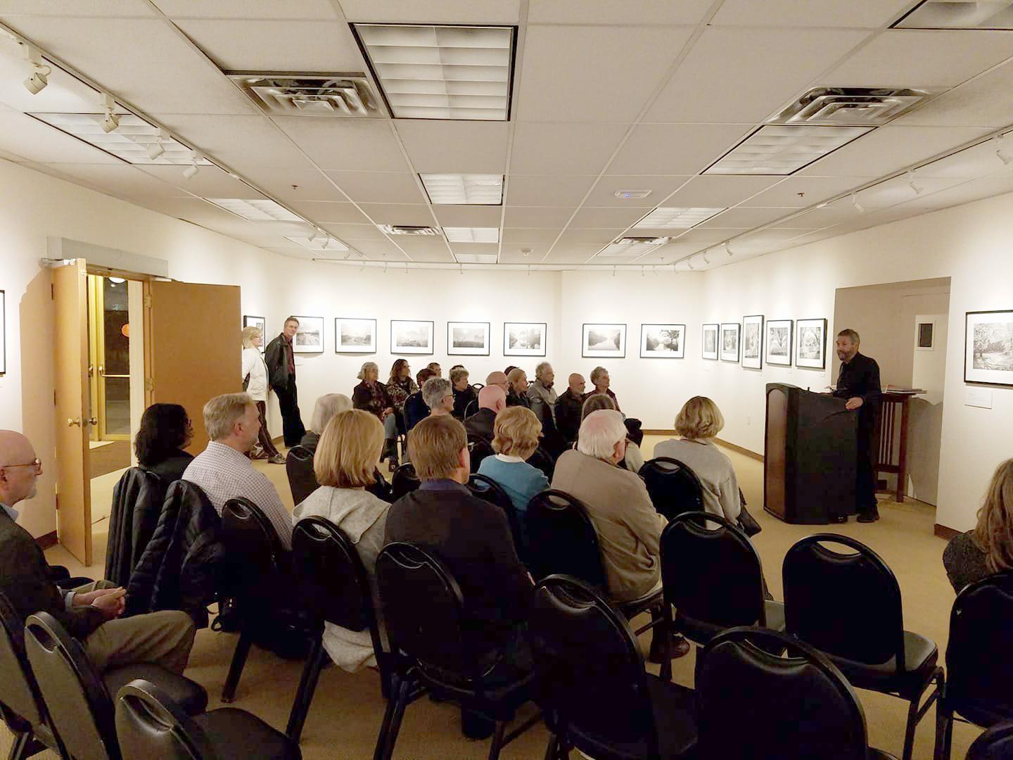 Friends of the Marin Center Room full of people listening to a presenter. 