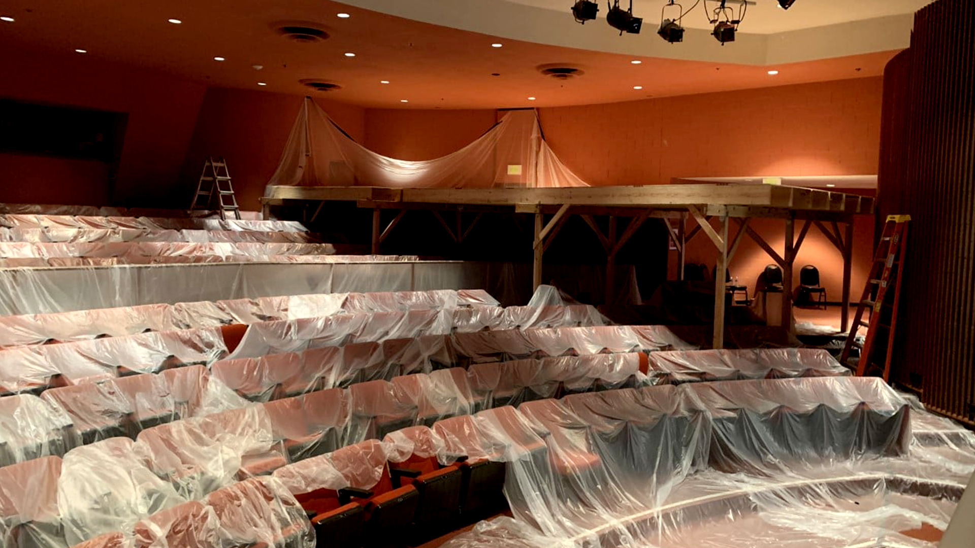 2021 photo showing interior of Showcase theater, showing seats covered in tarps. 