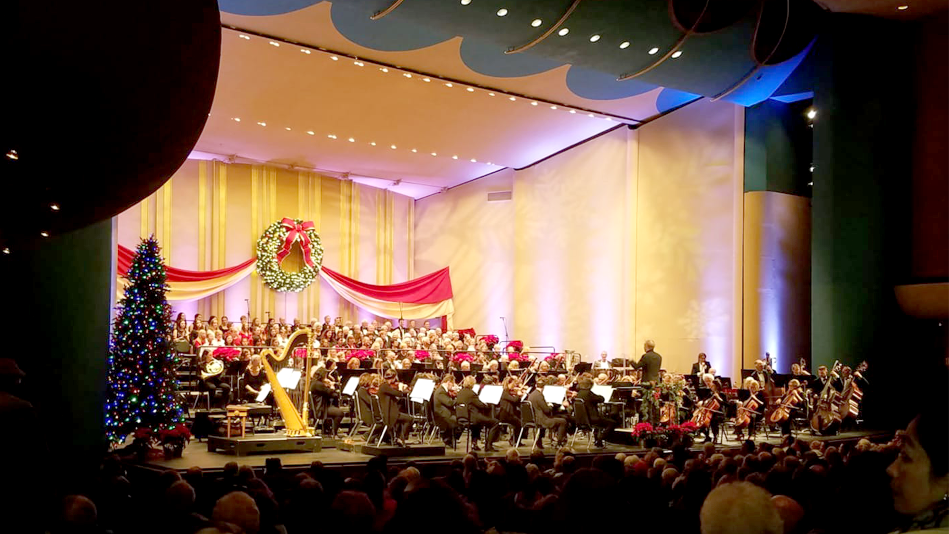 A symphony performs on stage at Veterans' Memorial Auditorium