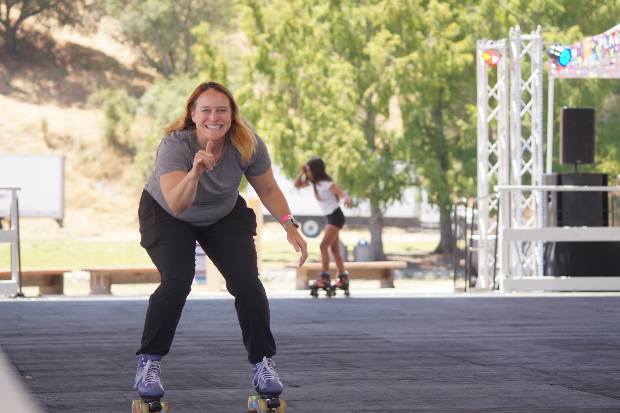 A woman zooms by on her roller skates at the Roller Disco Daze opening day.