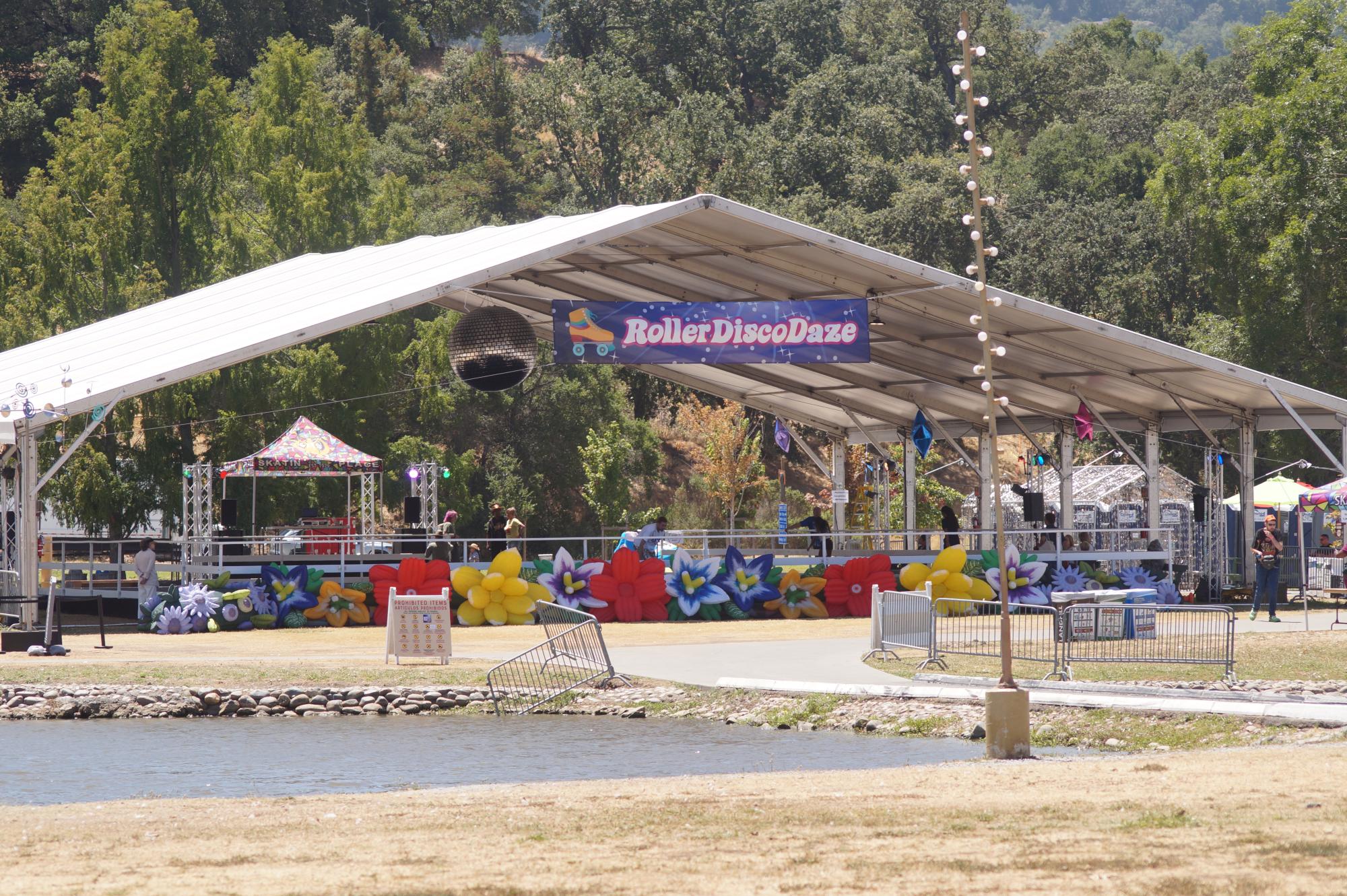 White Island tent where Roller Disco Daze event is held. There is a large disco ball hanging from the ceiling.