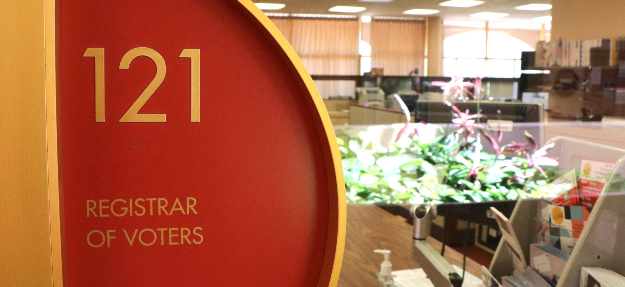 A closeup view of the sign on the door at the Registrar of Voters office
