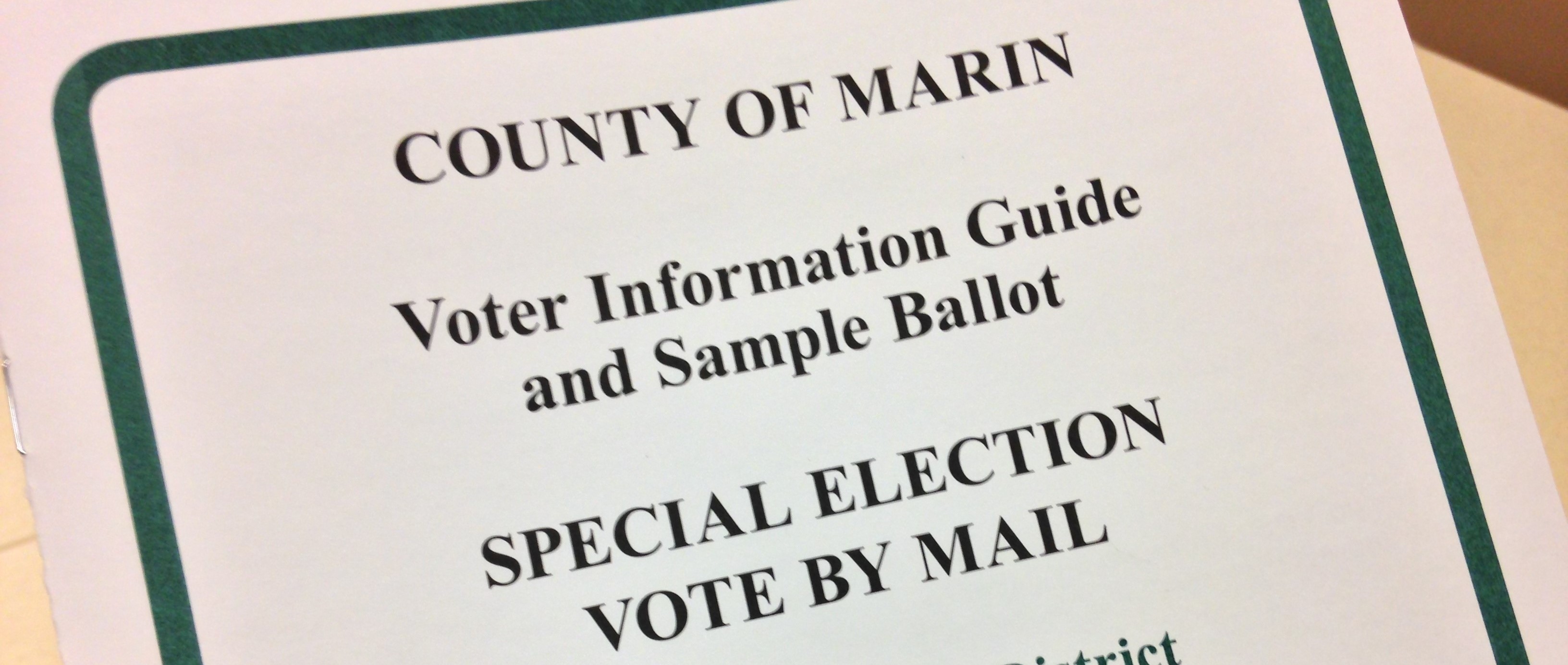 A closeup view of the cover sheet of a voter information guide.