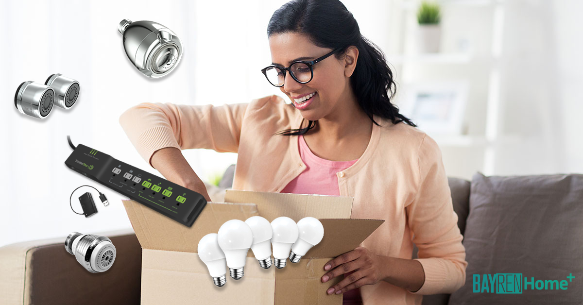 A woman smiles as she opens a box full of electricity-saving products.