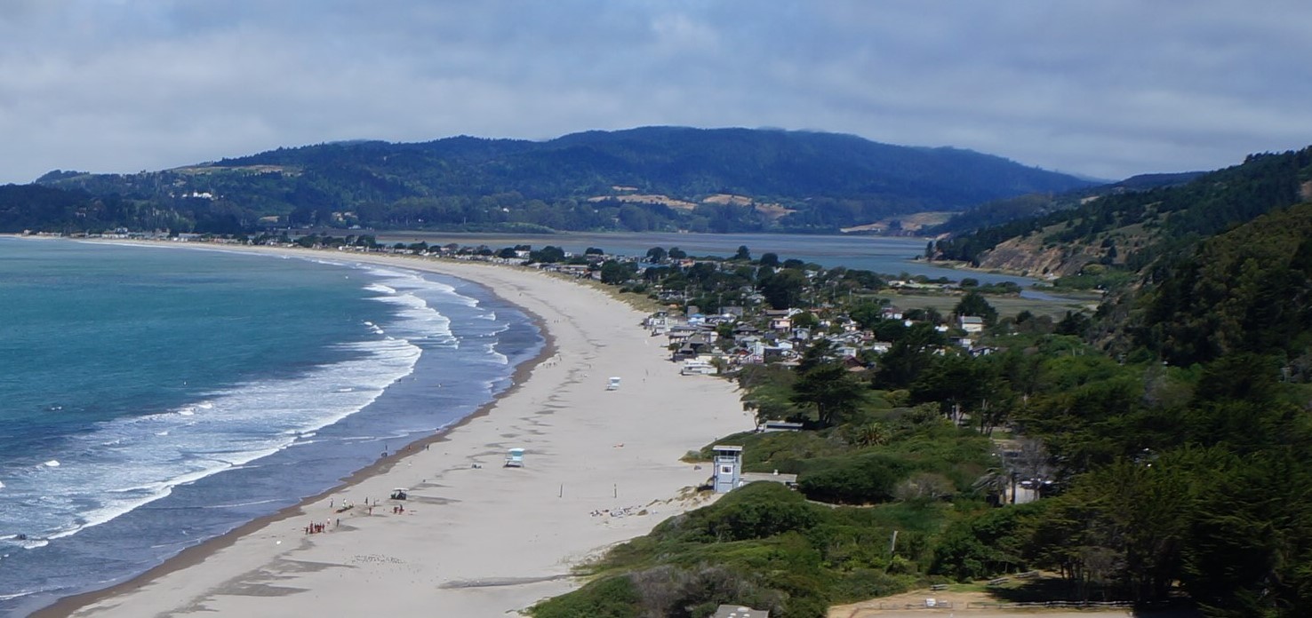 A hilltop view of Stinson Beach and Bolinas showing the beach, Pacific Ocean, and hills