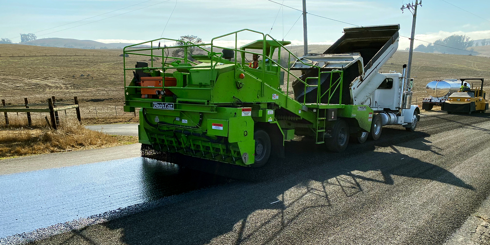 A large machine is used for road repaving.