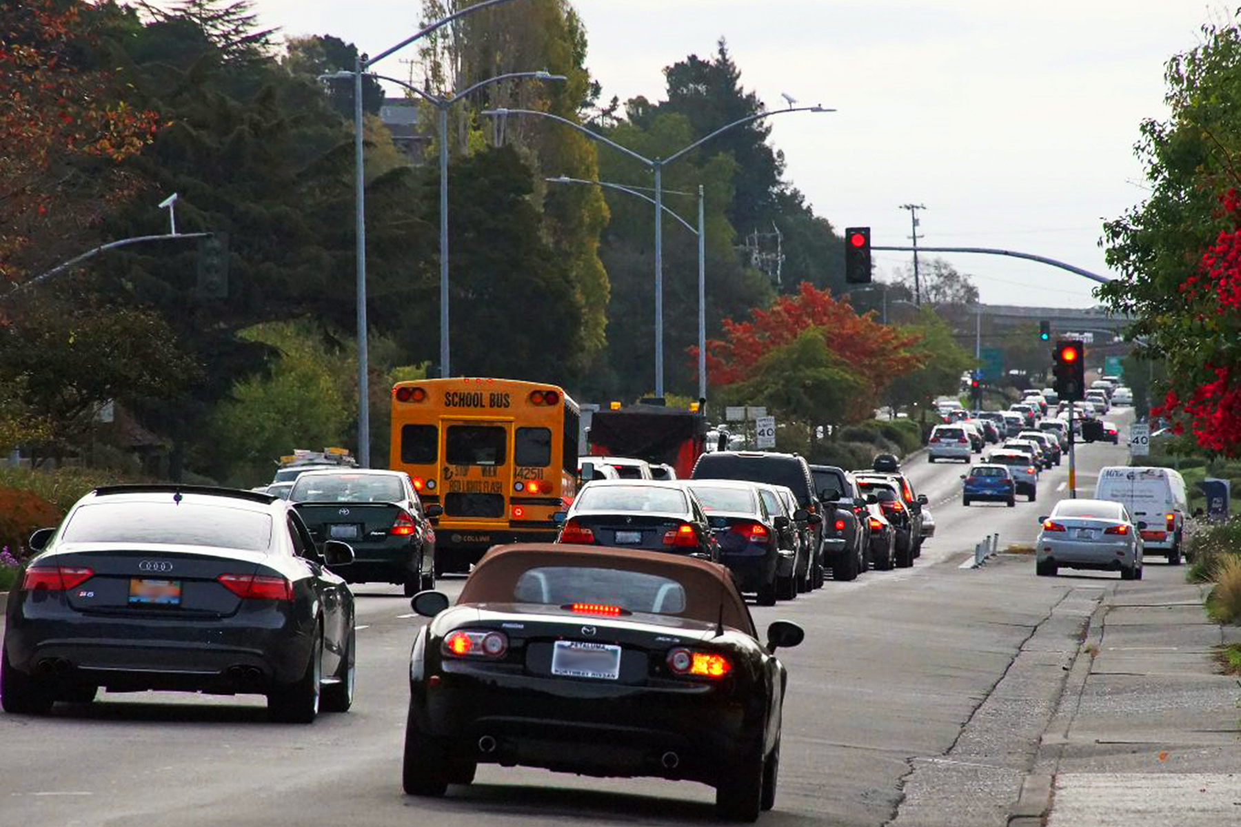 Cars drive on Sir Francis Drake Boulevard.