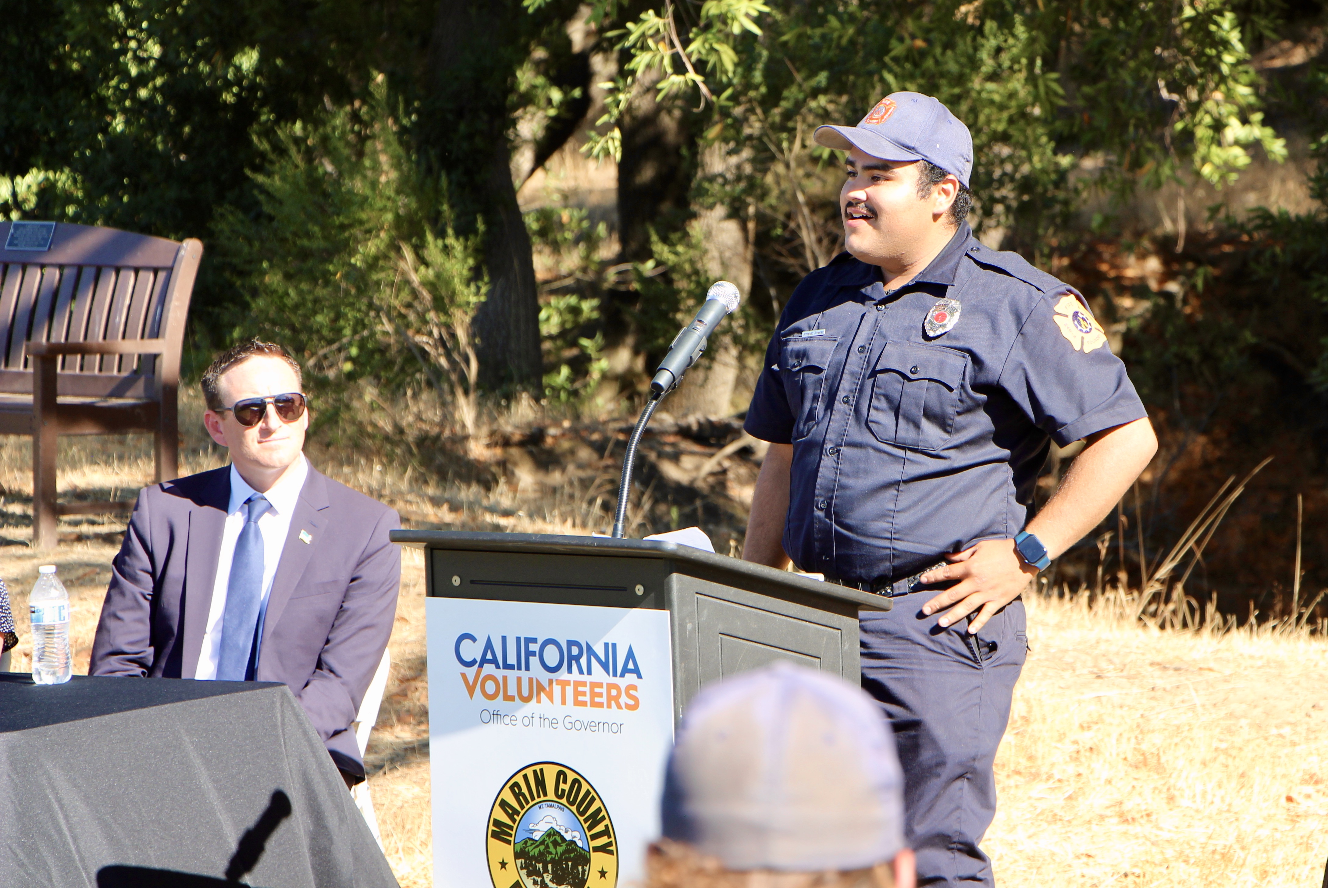 A FIRE Foundry program participant speaks at a press conference.