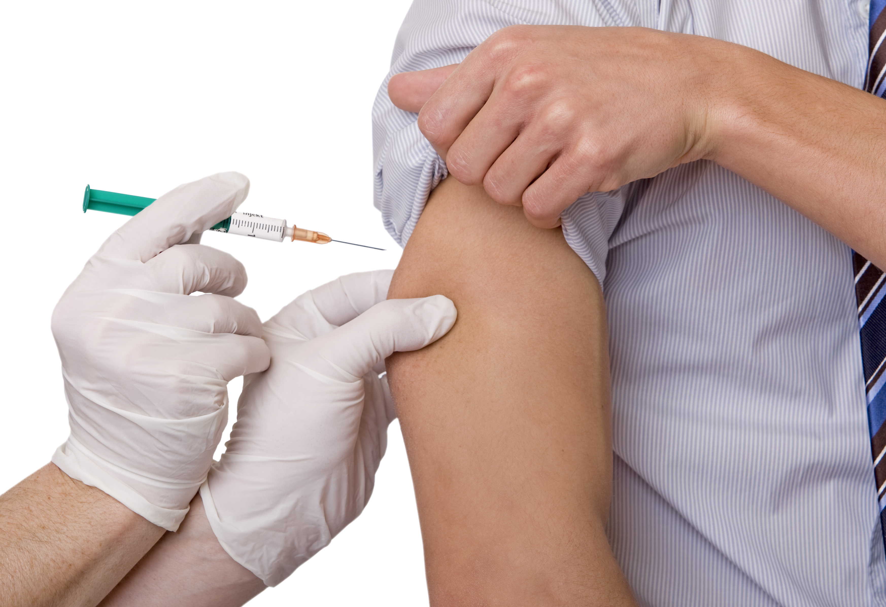 A closeup view of a person wearing protective gloves giving a shot to someone else's arm.