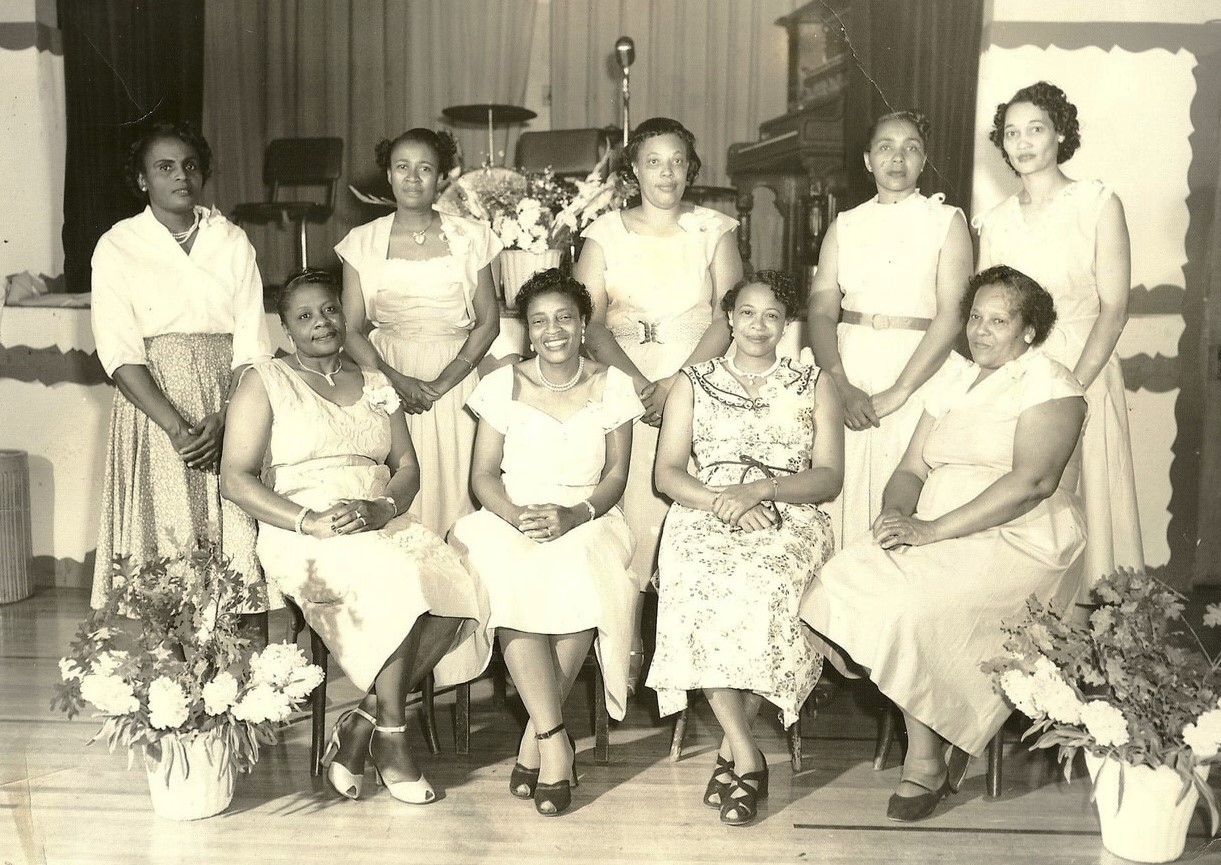 About a dozen women pose in Marin City during the 1950s.