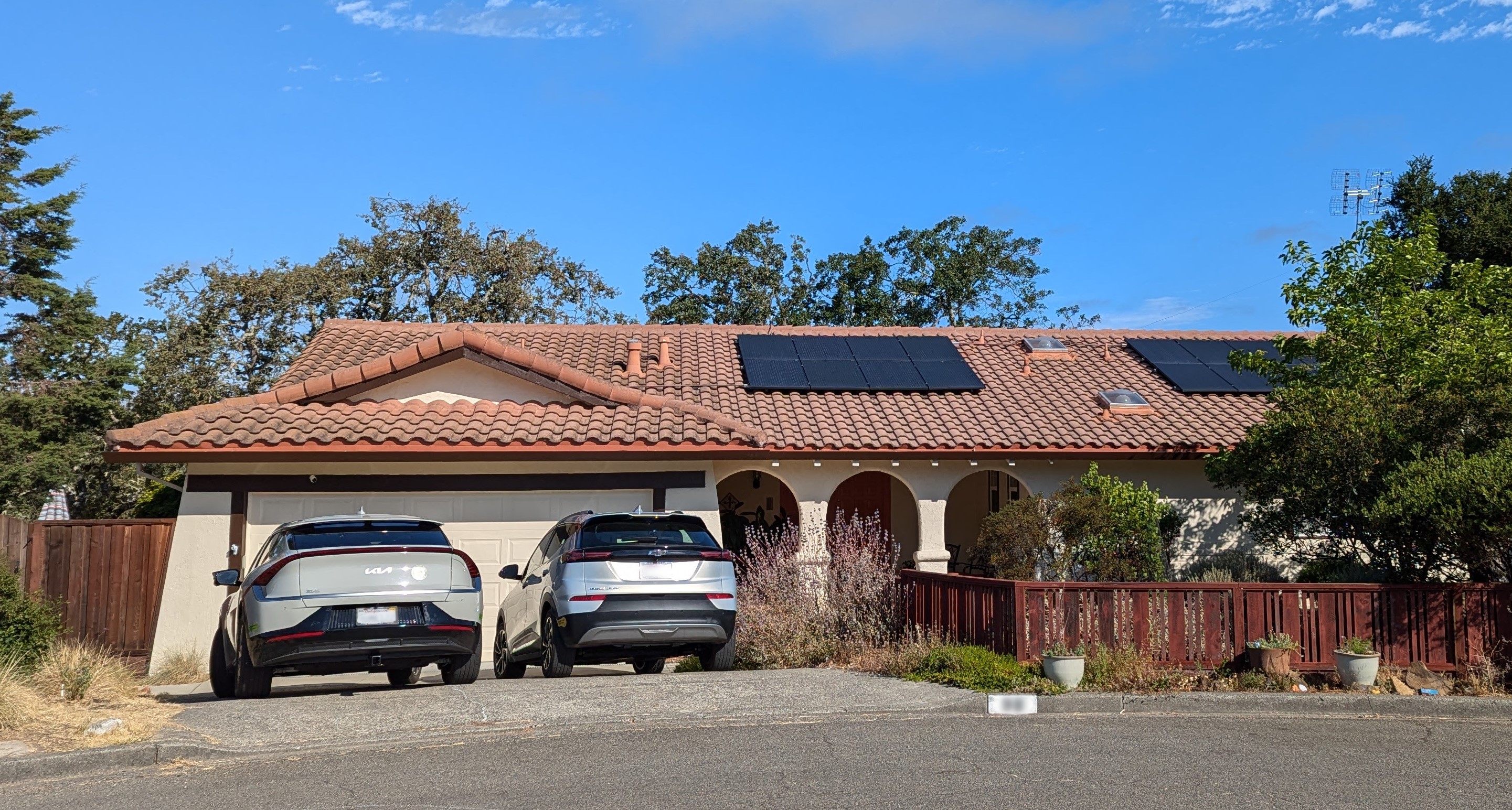 The front of a home with solar panels on the roof.