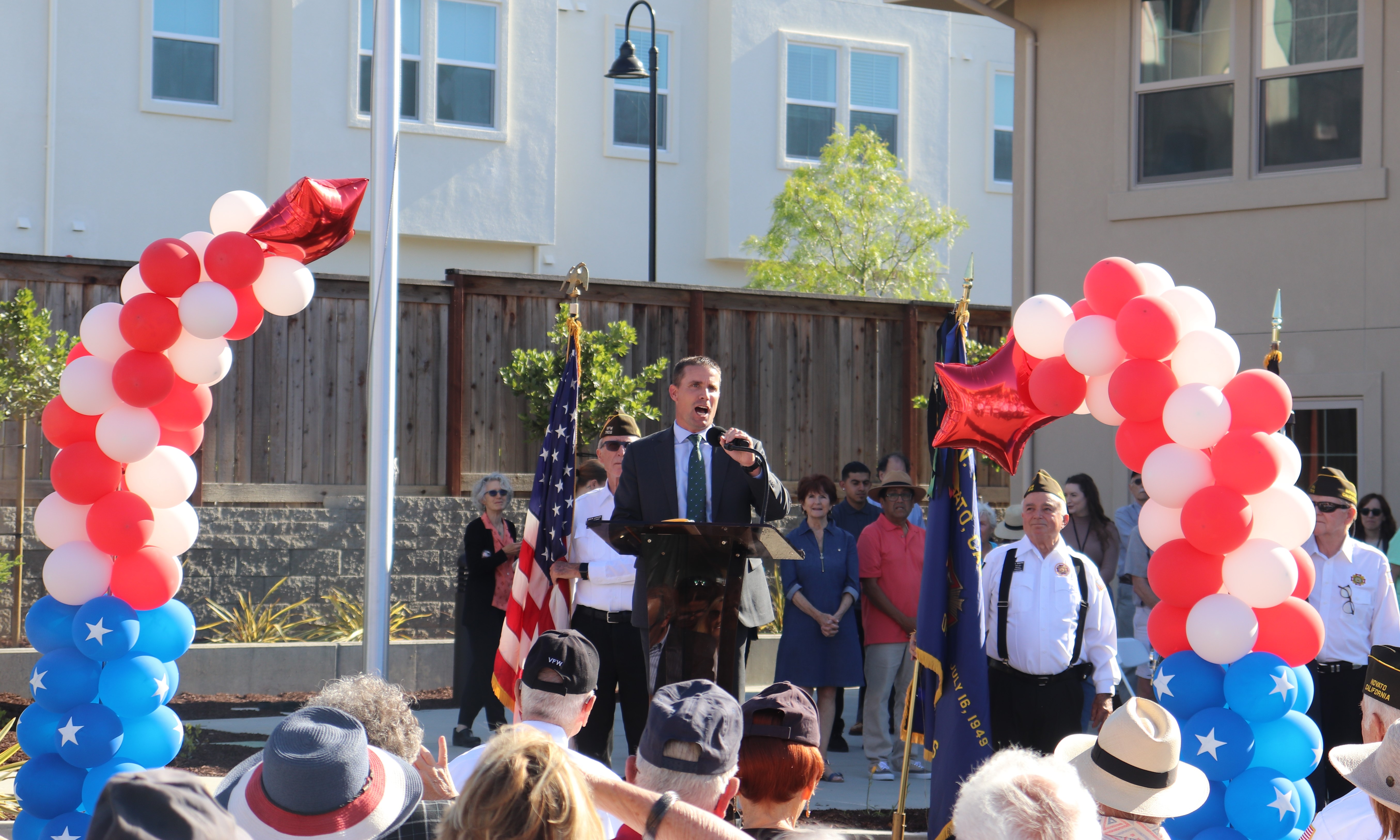 State Senator Mark McGuire addresses a crowd at the grand opening of a new housing project for homeless military veterans.