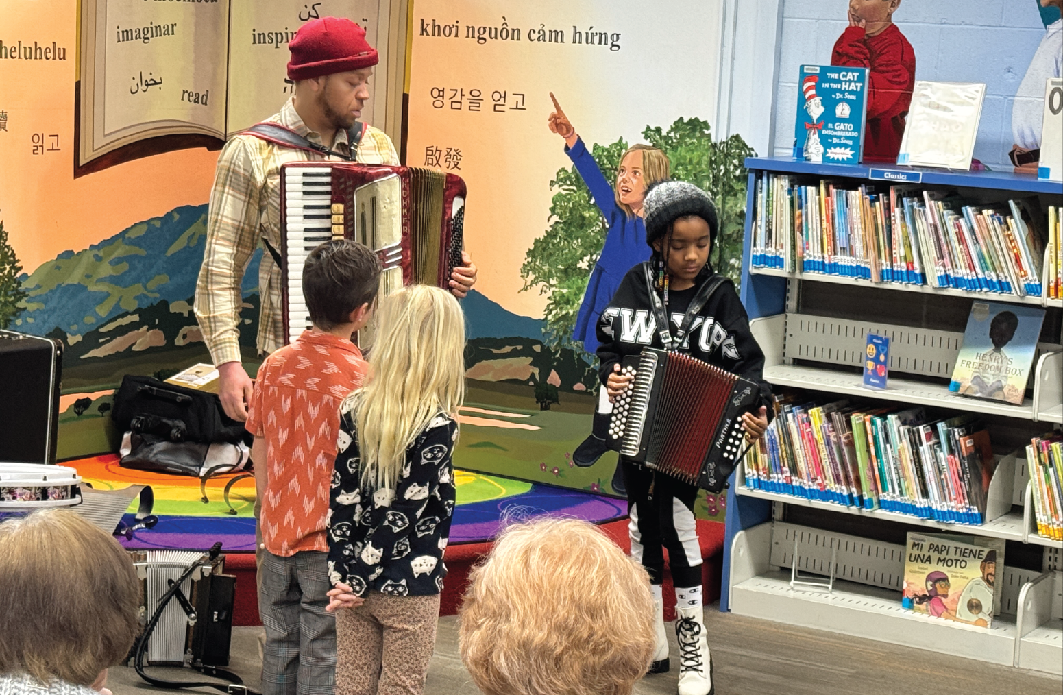 Andre Thierry leads a lively, interactive music session where kids join in.