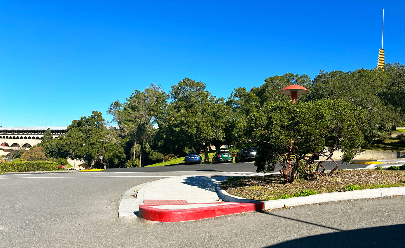 A view of a parking lot curb painted red outside the County Civic Center.