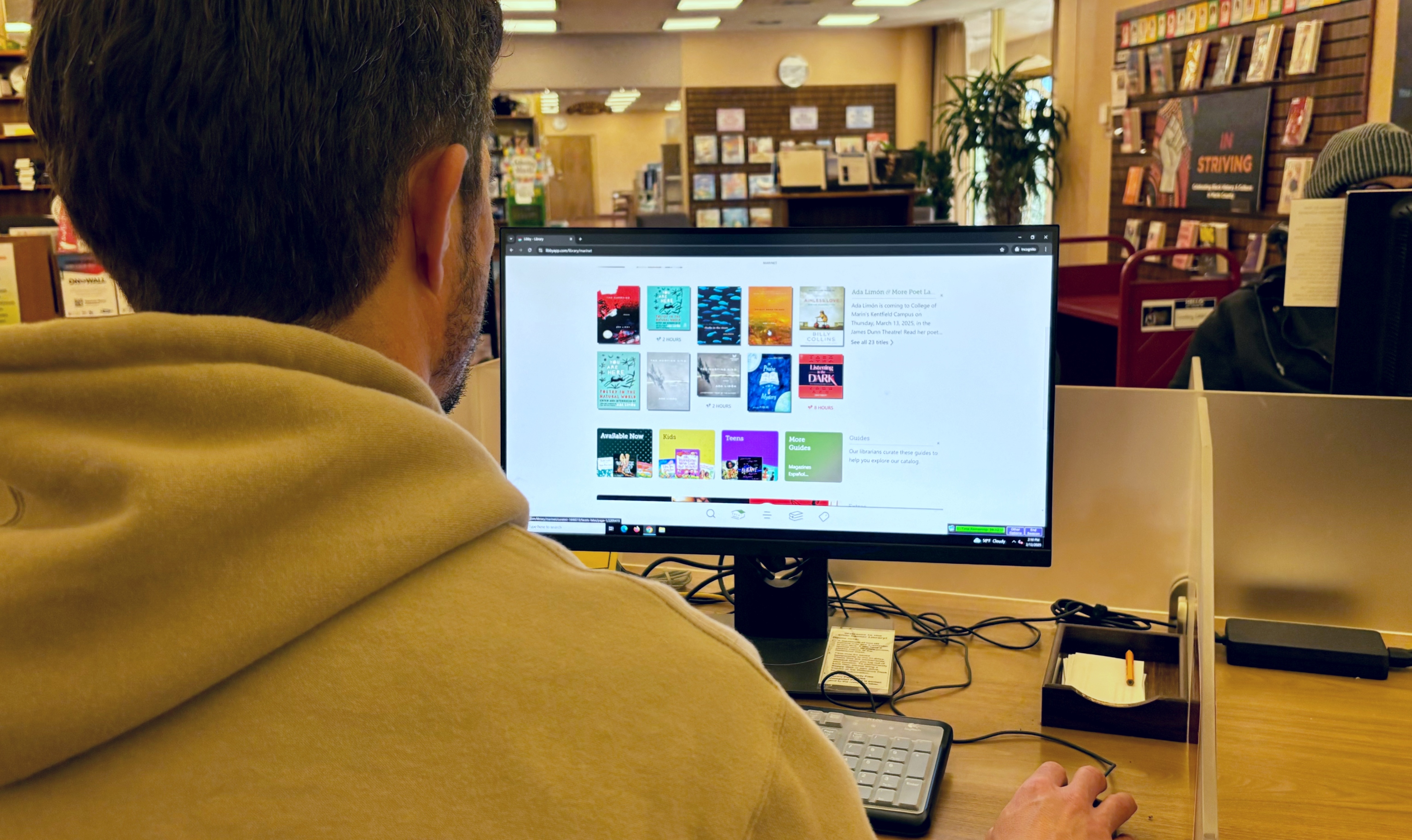 A man uses a laptop computer to check the MARINnet resource.