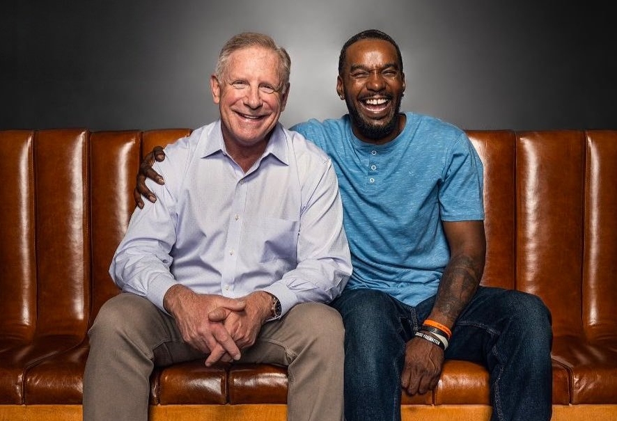 Former CHP officer Kevin Briggs, left, sits next to a man he saved from a suicide attempt, Kevin Berthia.