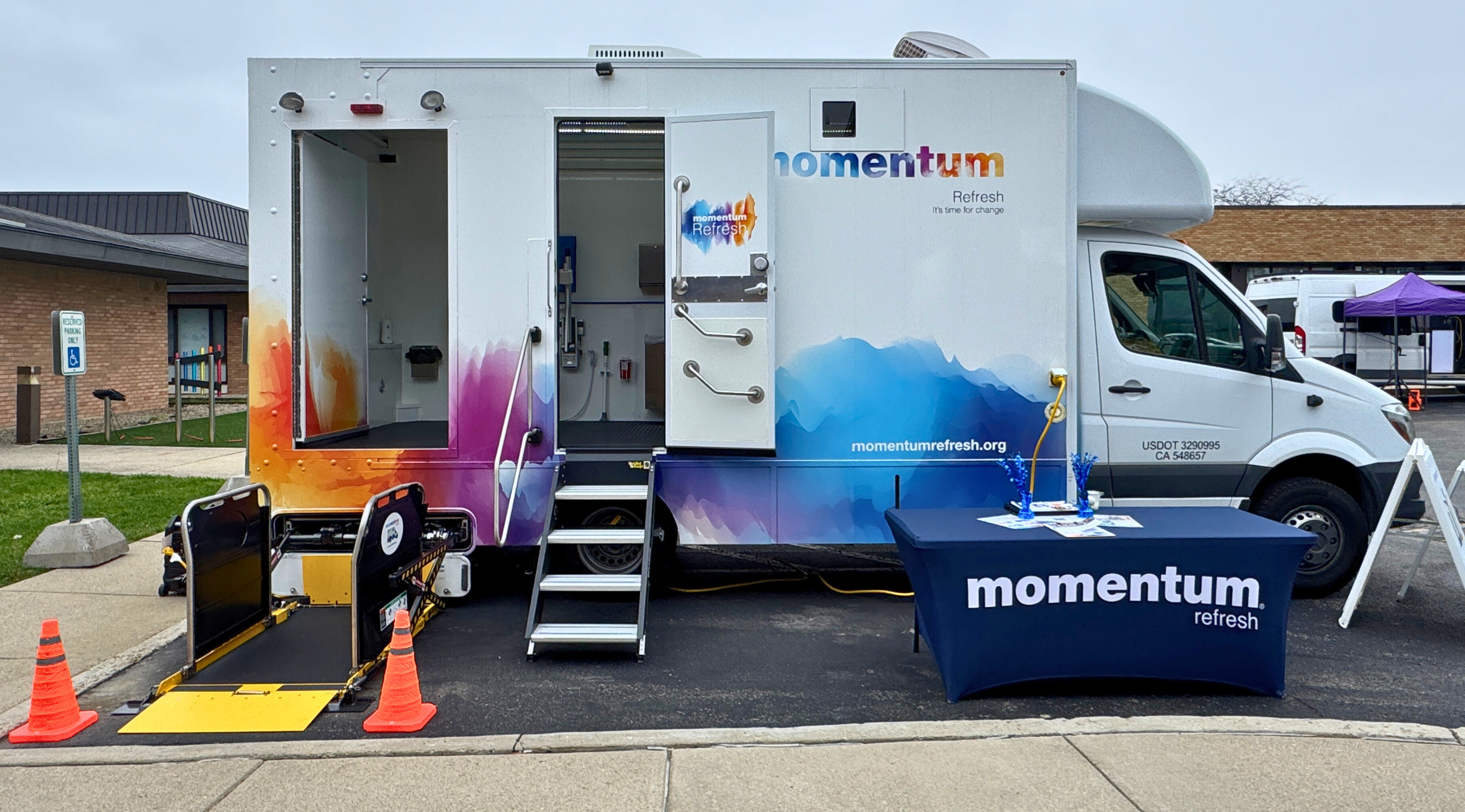 Refresh van in a parking lot.