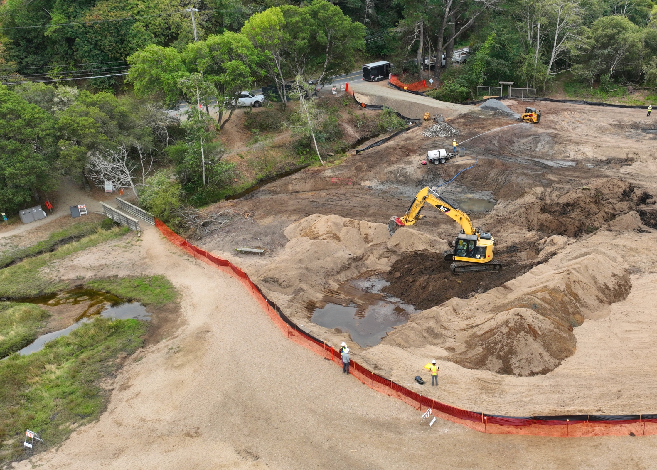 An aeria view of Chicken Ranch Beach and a work crew.