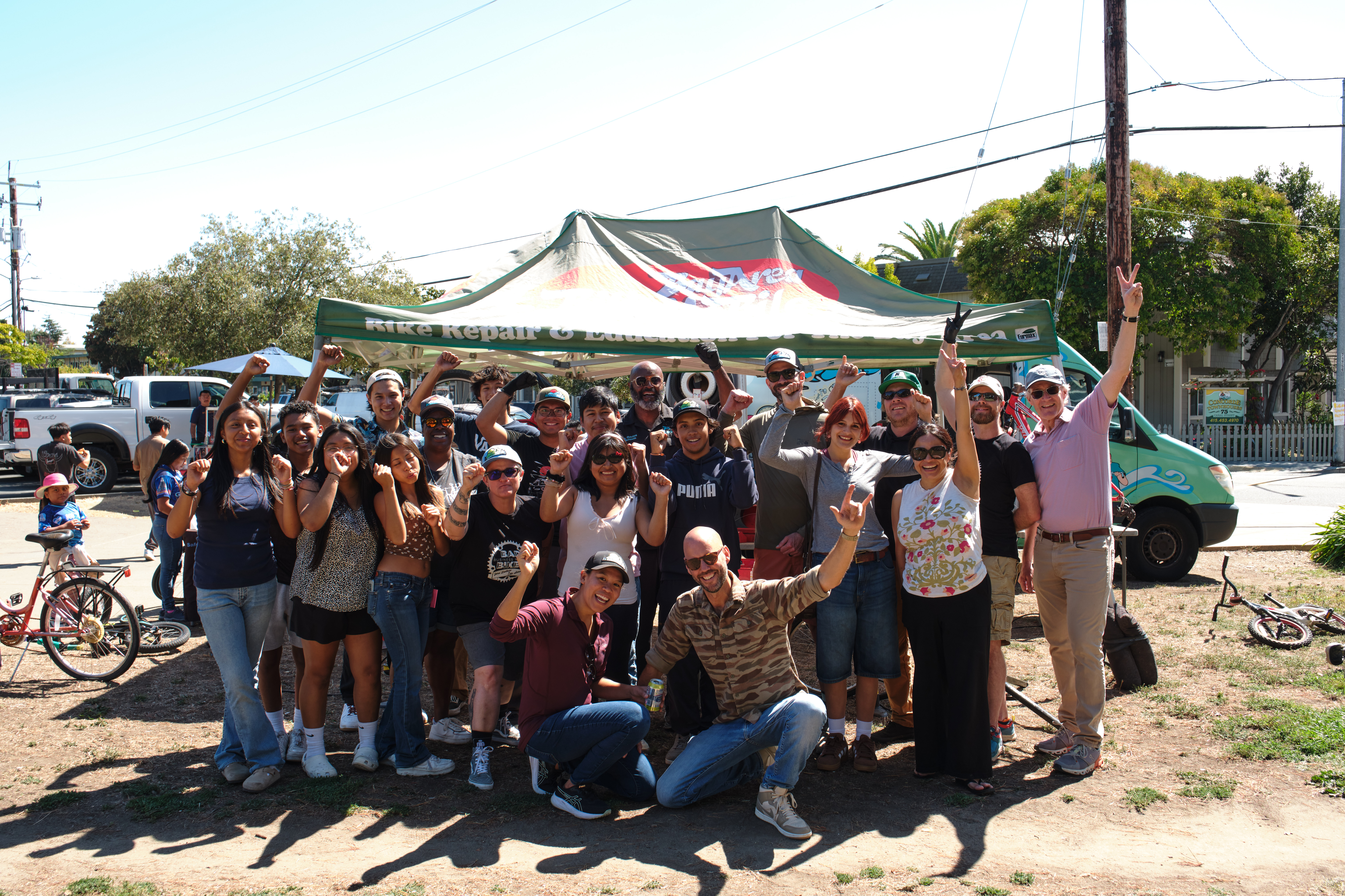 Several dozen people pose during an event that received funding from participatory budgeting.