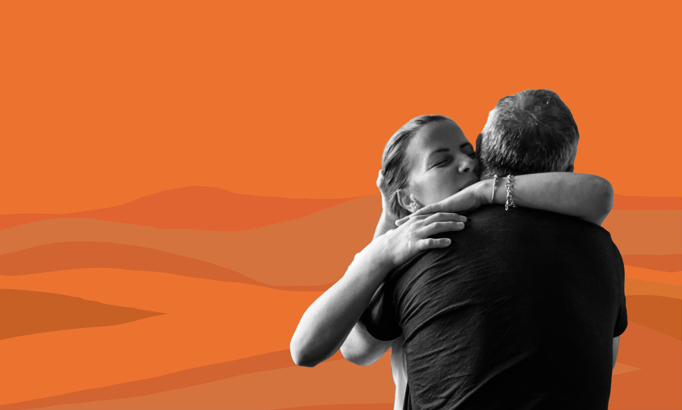 Artistic image shows a woman hugging a man in an emotional moment.
