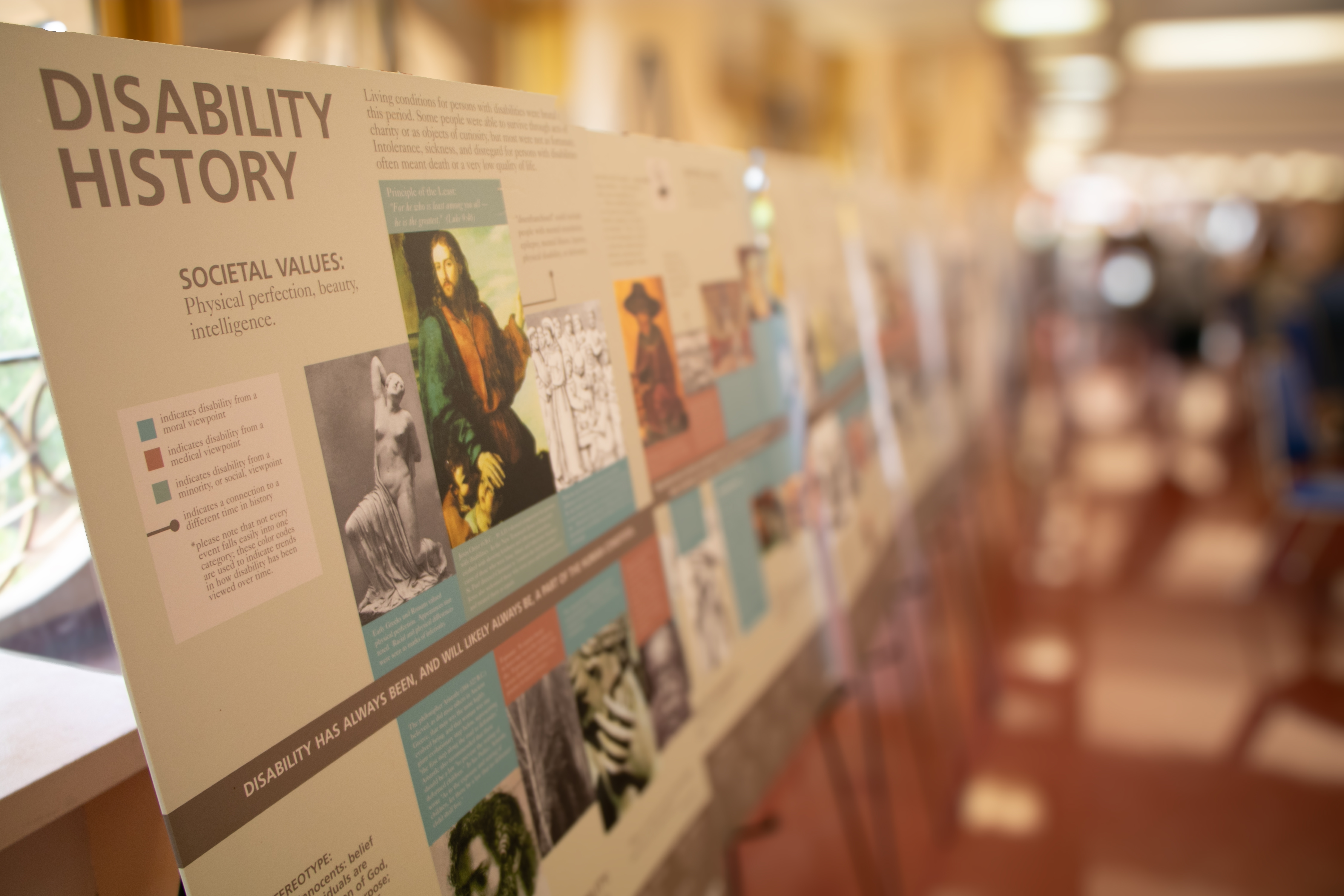 Poster display of the history of Disability Pride through the years.