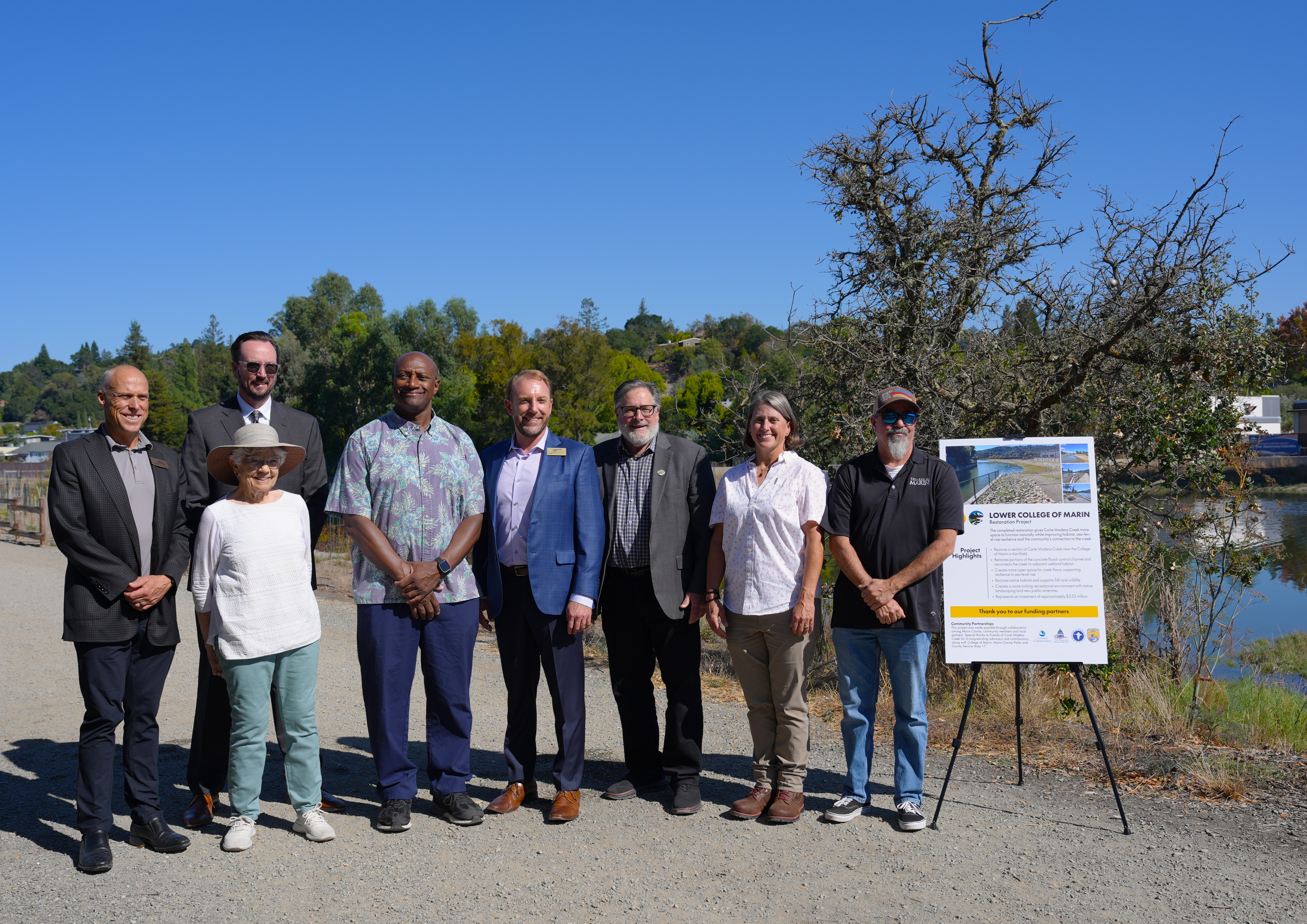 Marin County officials standing next to the Lower College of Marin Restoration Project and celebrate the completion of the project.