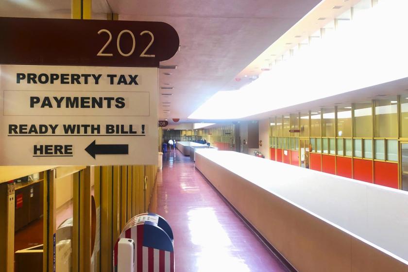 A closeup view of the sign at the Civic Center that says Room 202, Property Tax Payments.