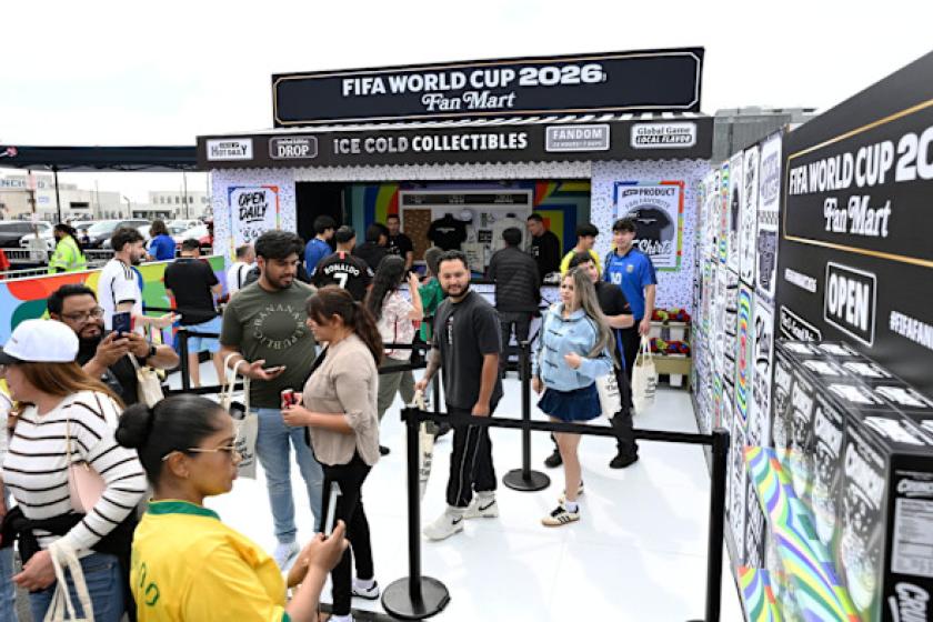 People standing in line to view the FIFA World Cup trophy.