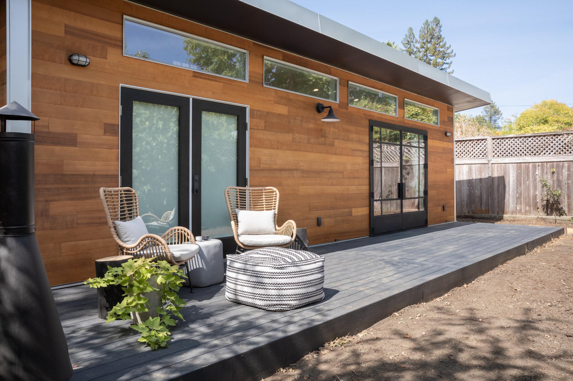 New detached prefabricated ADU in San Anselmo with outdoor deck and seating.