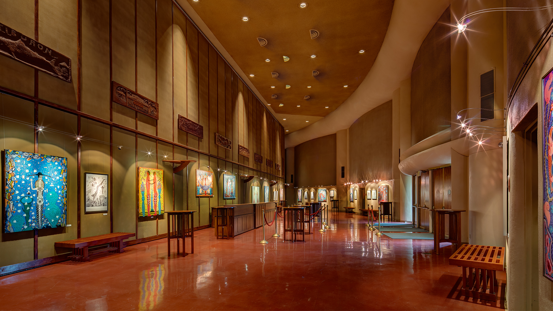 A hallway in the Civic Center with art work displayed.