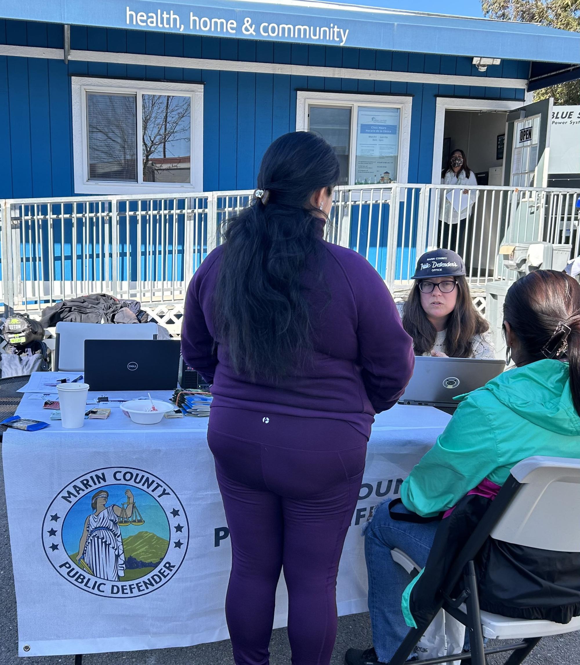 Staff speaking with clients at Ritter Center.