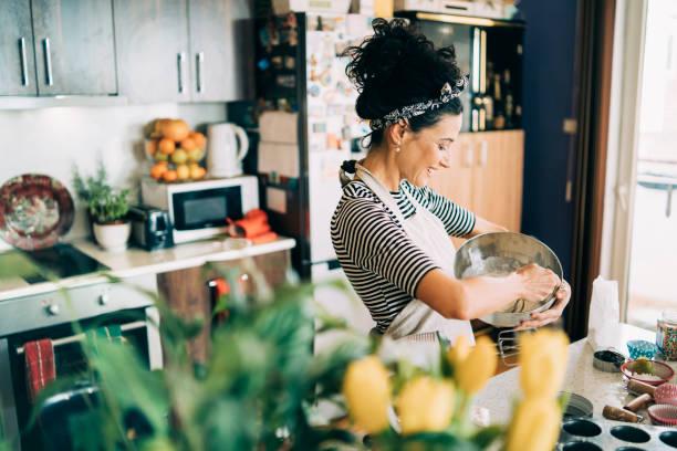 Woman cooking in a home kitchen