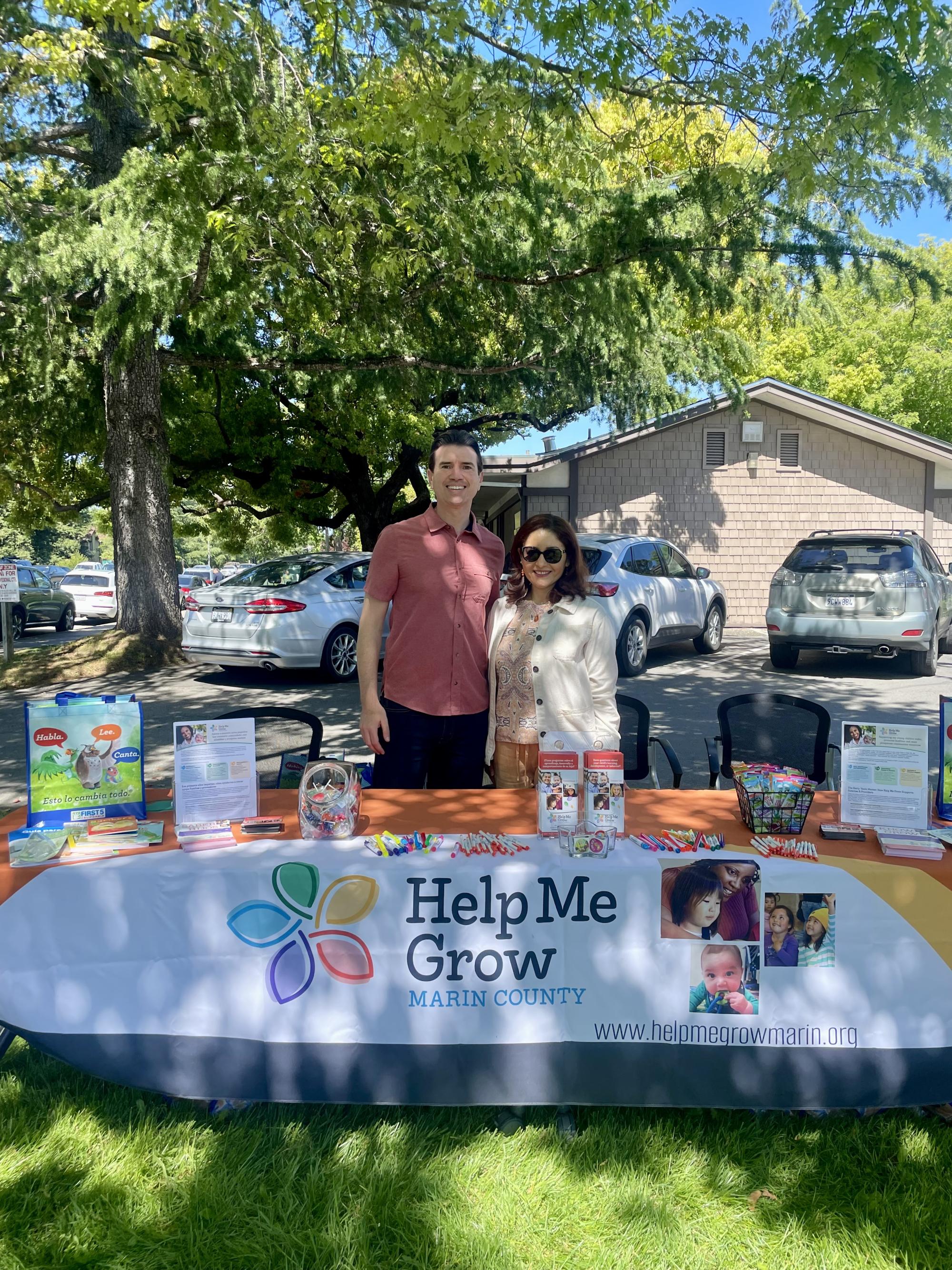 Supervisor Lucan and Maritza Barahona hosting booth at Primaveras 2024 event. 