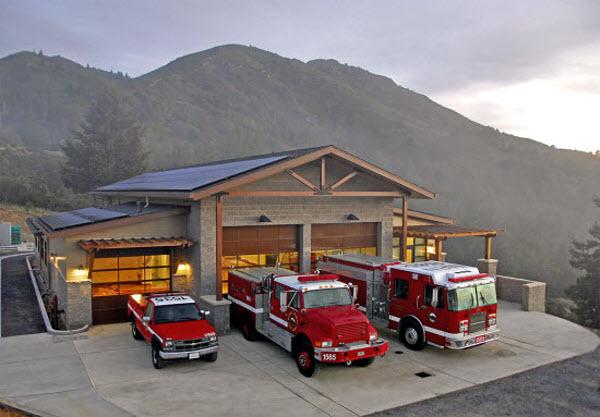 Two fire trucks and a red pickup truck outside of Throckmorton Fire Station 