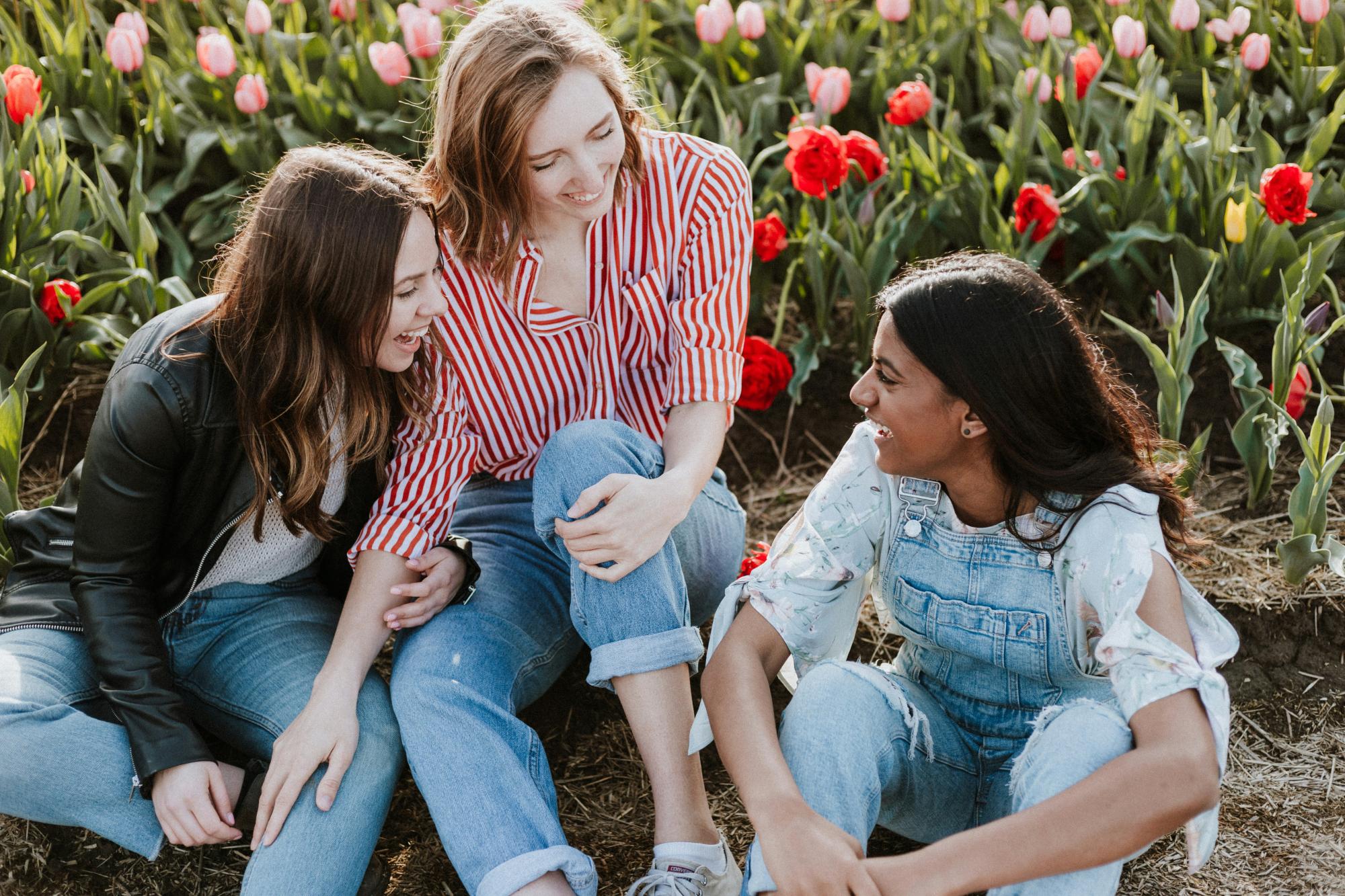 Young people smiling and chatting together.