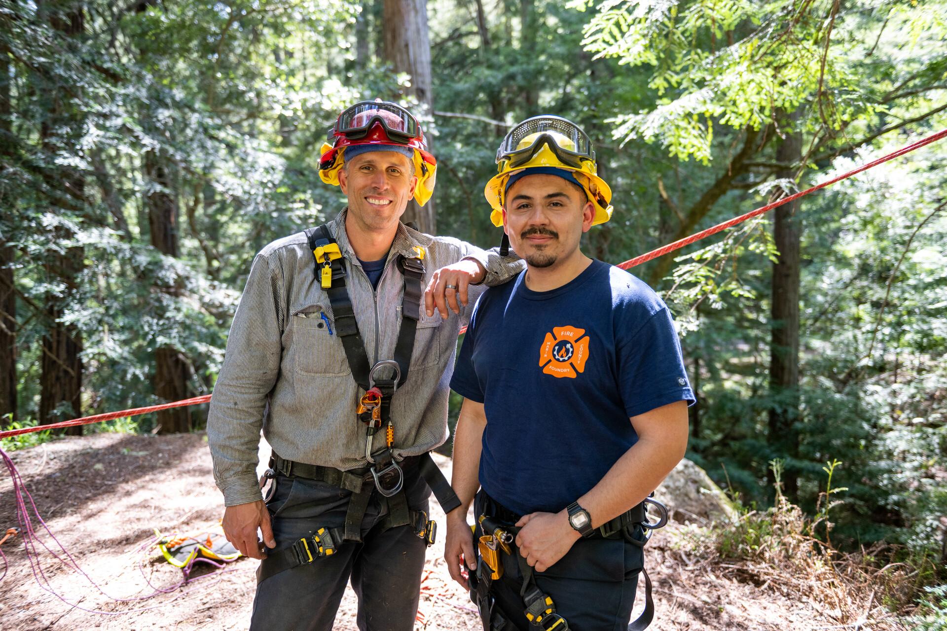 Field Supervisor Darrell Galli and Lupe Duran pose for a portrait during a FIRE Foundry rope rescue training in Marin on April 21, 2023. (Beth LaBerge/KQED).