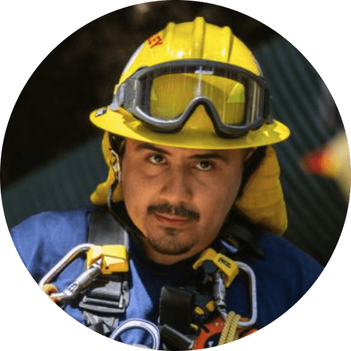 A headshot of a man wearing firefighting gear.