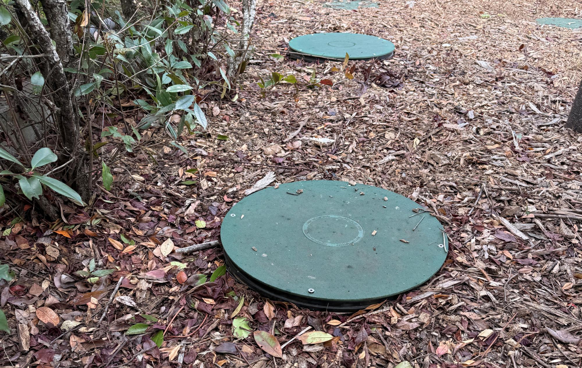 Close-up of a septic system during an inspection.