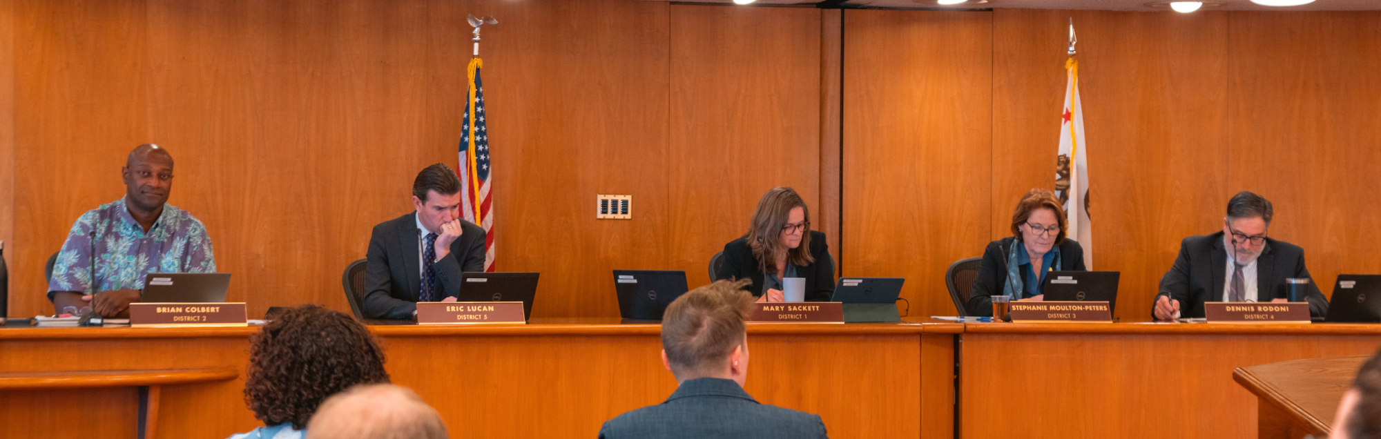 Board members seated at the board of chambers.