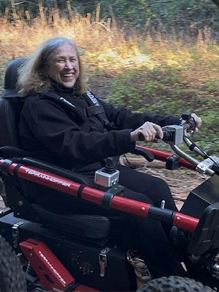 woman in a TerrainHopper mobility device