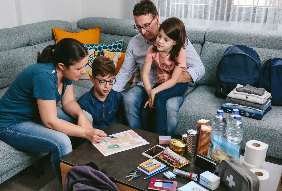 Family gathered around a table preparing for an emergency